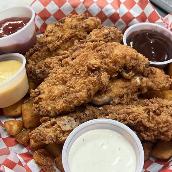 Crispy fried chicken tenders and tater tots with ketchup, honey mustard, BBQ, and ranch dipping sauces.