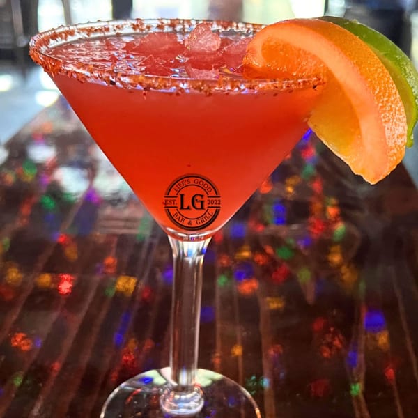 Life's Good Bar & Grill's red martini with a chili-lime rim and citrus garnish.